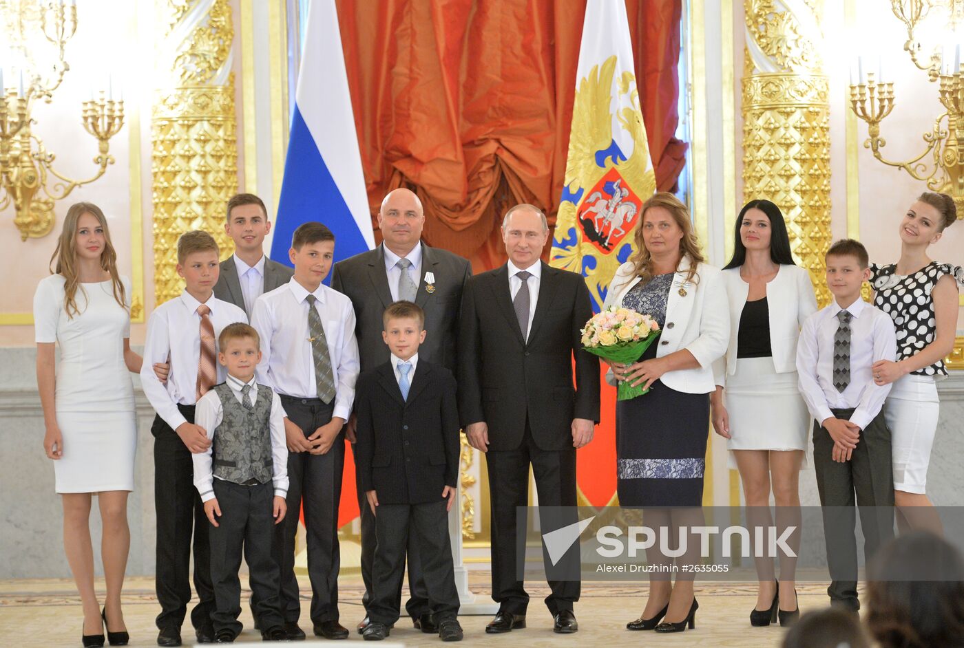 Russian President V.Putin presents Orders of Parental Glory to parents of large families