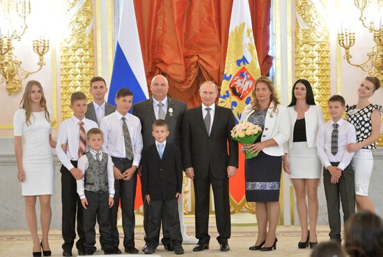 Russian President V.Putin presents Orders of Parental Glory to parents of large families