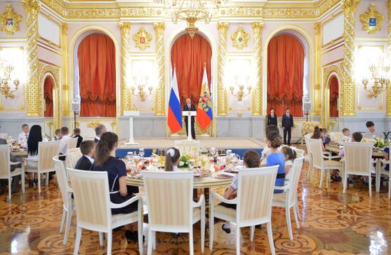 Russian President V.Putin presents Orders of Parental Glory to parents of large families