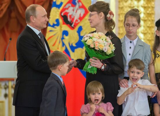 Russian President V.Putin presents Orders of Parental Glory to parents of large families