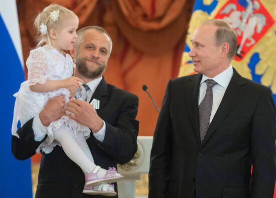 Russian President V.Putin presents Orders of Parental Glory to parents of large families