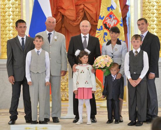 Russian President V.Putin presents Orders of Parental Glory to parents of large families