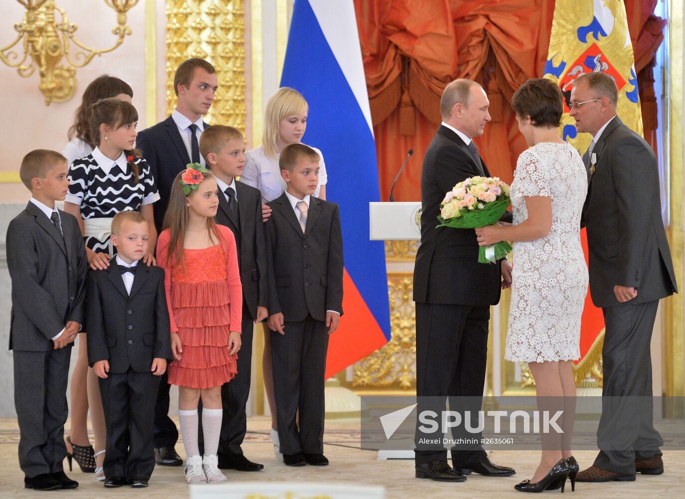 Russian President V.Putin presents Orders of Parental Glory to parents of large families