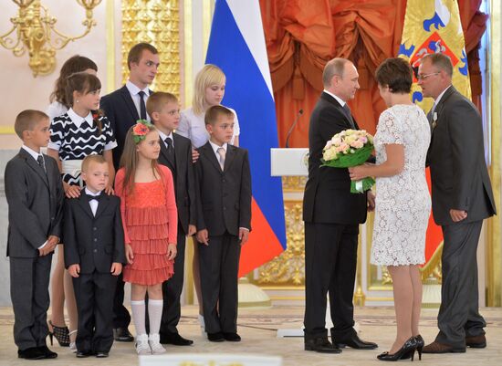 Russian President V.Putin presents Orders of Parental Glory to parents of large families