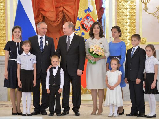 Russian President V.Putin presents Orders of Parental Glory to parents of large families