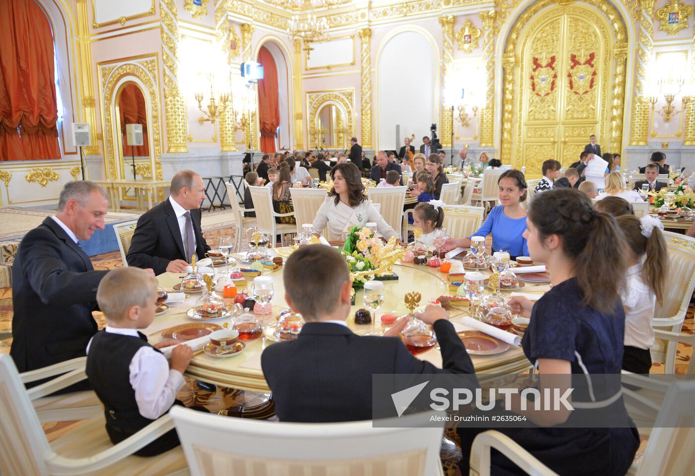 Russian President V.Putin presents Orders of Parental Glory to parents of large families