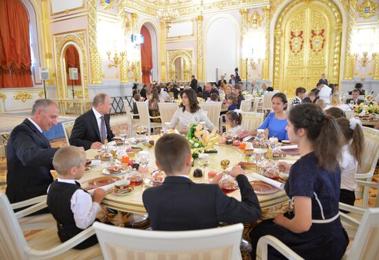 Russian President V.Putin presents Orders of Parental Glory to parents of large families
