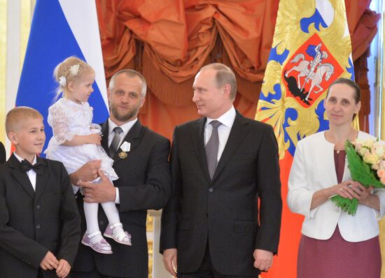 Russian President V.Putin presents Orders of Parental Glory to parents of large families