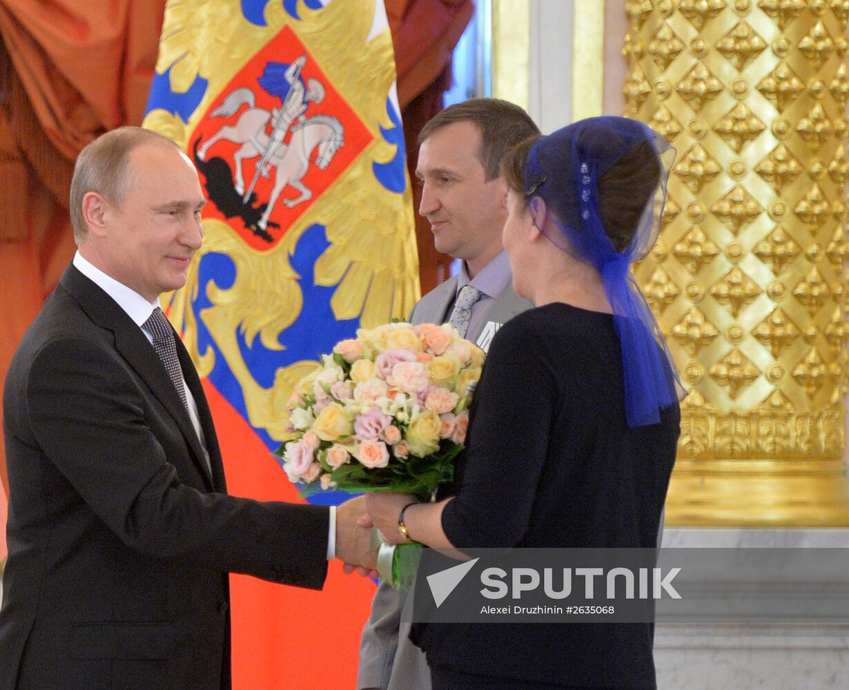 Russian President V.Putin presents Orders of Parental Glory to parents of large families