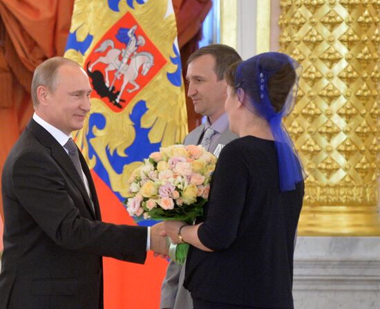 Russian President V.Putin presents Orders of Parental Glory to parents of large families