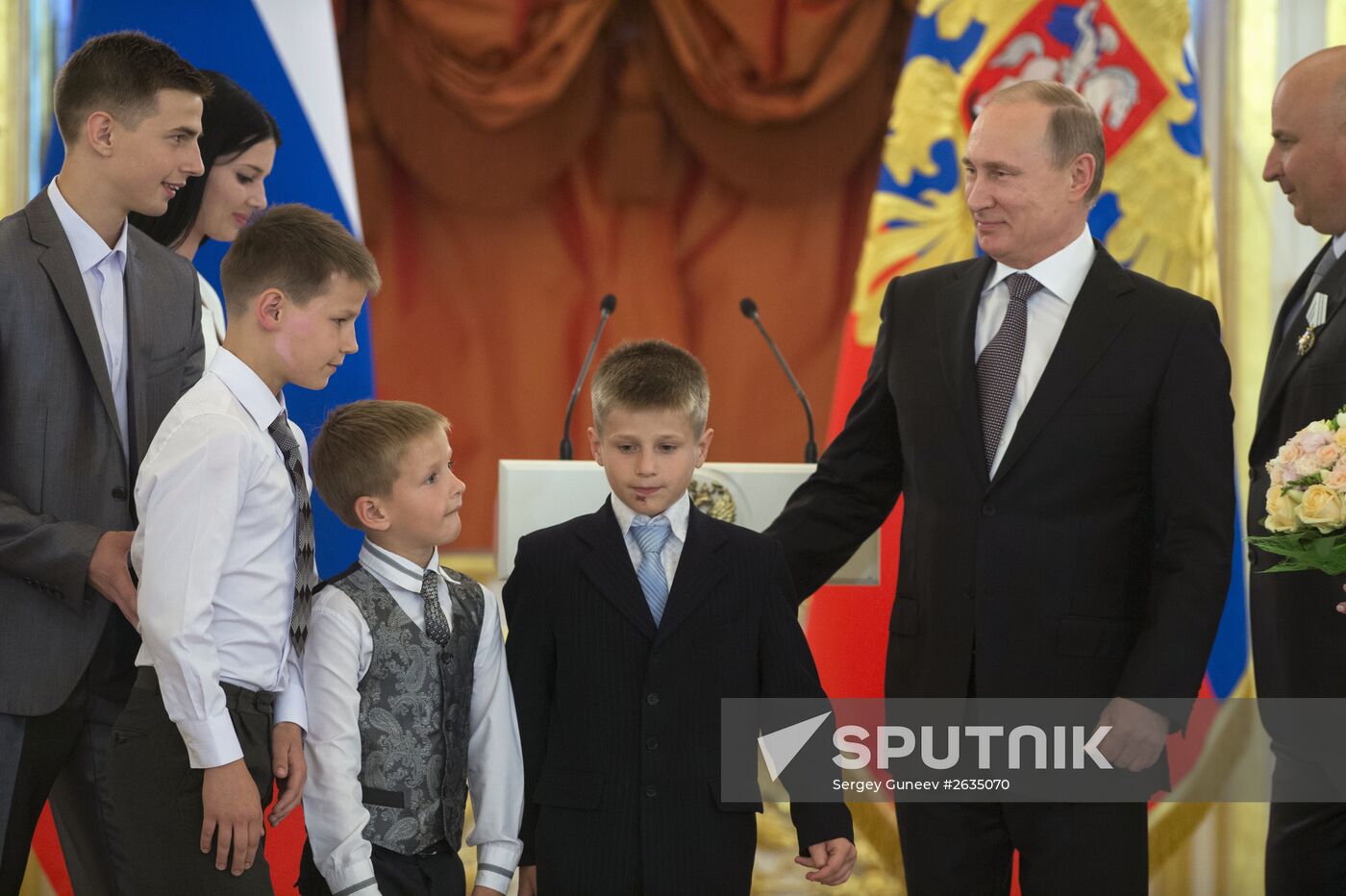 Russian President V.Putin presents Orders of Parental Glory to parents of large families