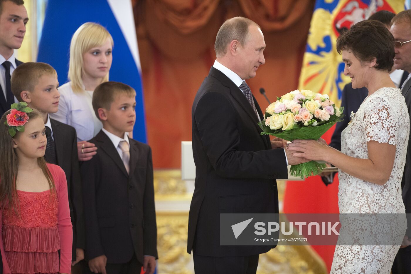 Russian President V.Putin presents Orders of Parental Glory to parents of large families
