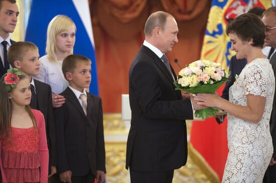 Russian President V.Putin presents Orders of Parental Glory to parents of large families