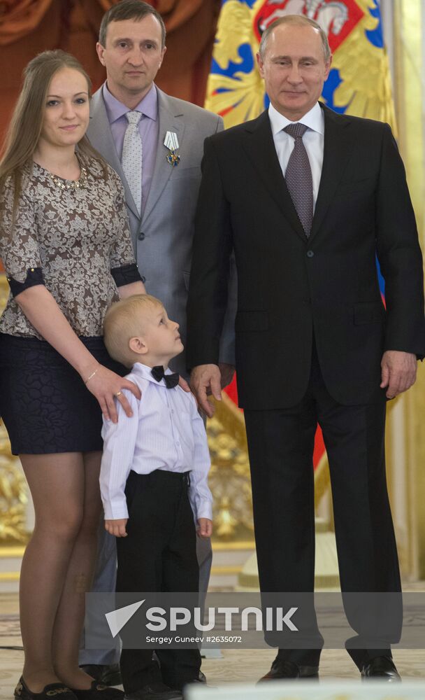 Russian President V.Putin presents Orders of Parental Glory to parents of large families