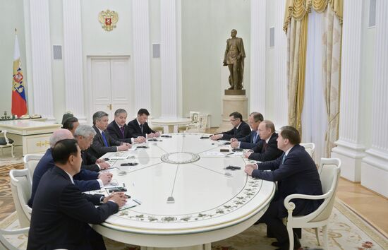 Russian President Vladimir Putin meets with attendees at SCO Council of Ministers of Foreign Affairs Meeting