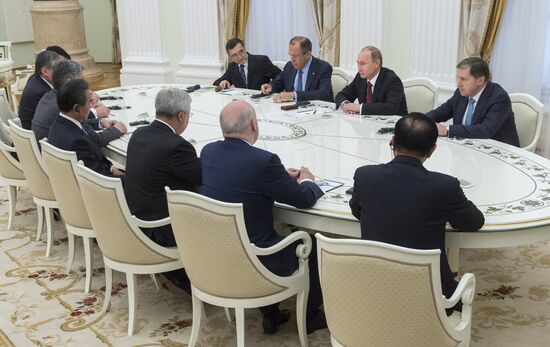 Russian President Vladimir Putin meets with attendees at SCO Council of Ministers of Foreign Affairs Meeting