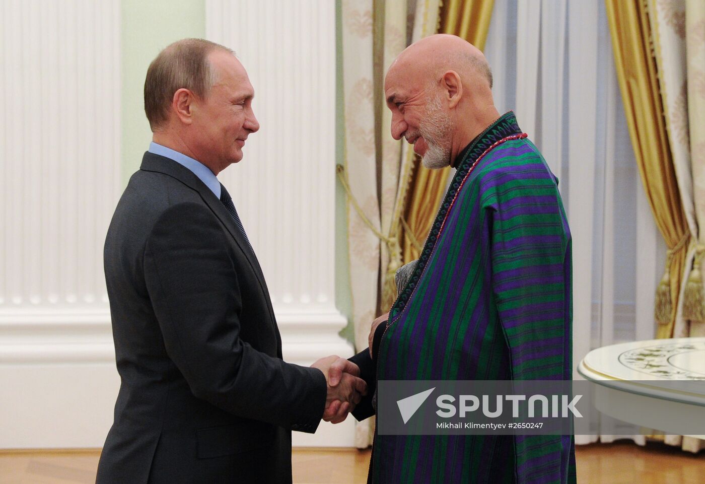 Vladimir Putin meets with former Afghan President Hamid Karzai