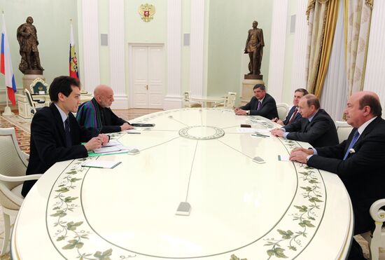 Vladimir Putin meets with former Afghan President Hamid Karzai