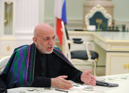 Vladimir Putin meets with former Afghan President Hamid Karzai