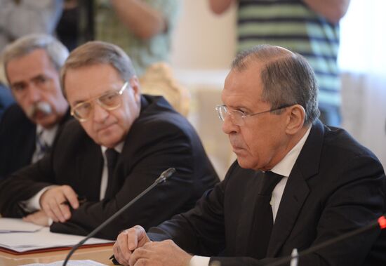 Russian Foreign Minister Sergei Lavrov meets with his Syrian counterpart Walid Muallem