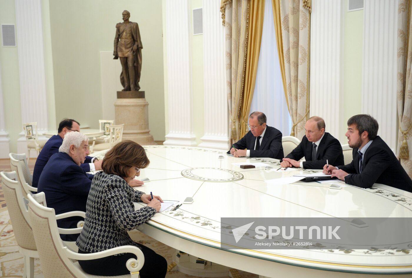 Russian President Vladimir Putin meets with Syrian Foreign Minister Walid Muallem