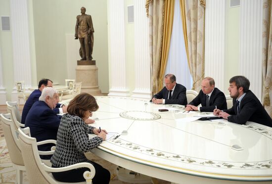 Russian President Vladimir Putin meets with Syrian Foreign Minister Walid Muallem