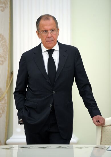 Russian President Vladimir Putin meets with Syrian Foreign Minister Walid Muallem