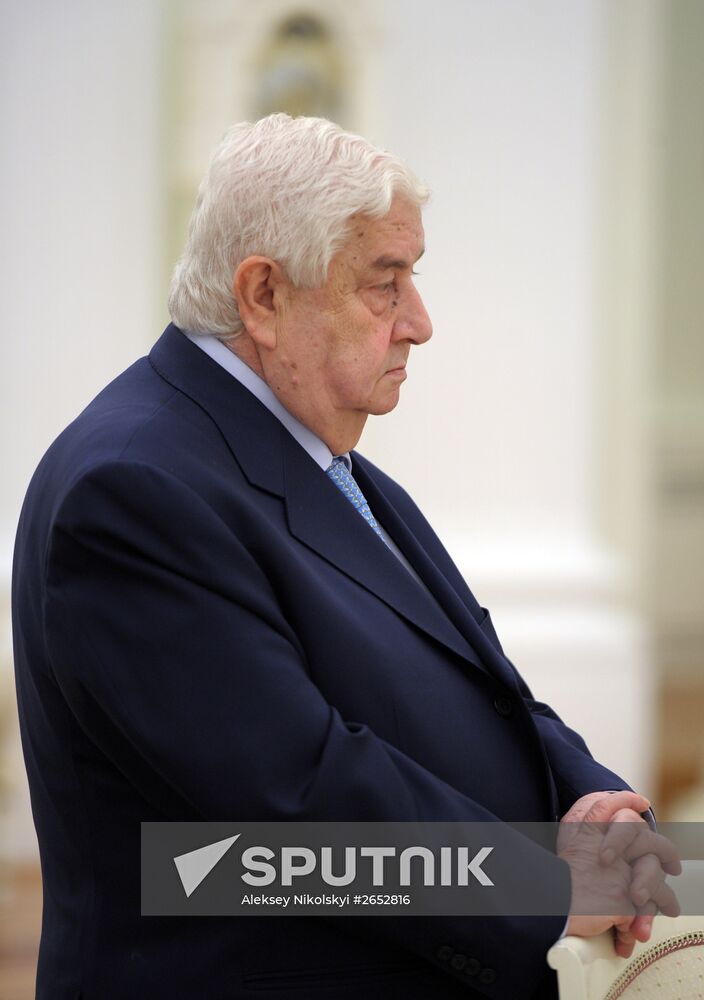 Russian President Vladimir Putin meets with Syrian Foreign Minister Walid Muallem