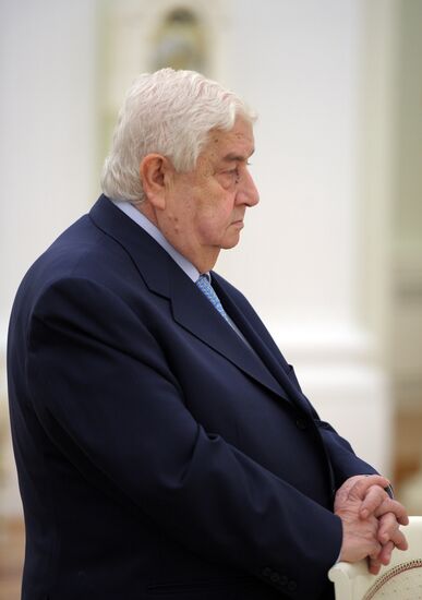 Russian President Vladimir Putin meets with Syrian Foreign Minister Walid Muallem