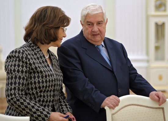 Russian President Vladimir Putin meets with Syrian Foreign Minister Walid Muallem