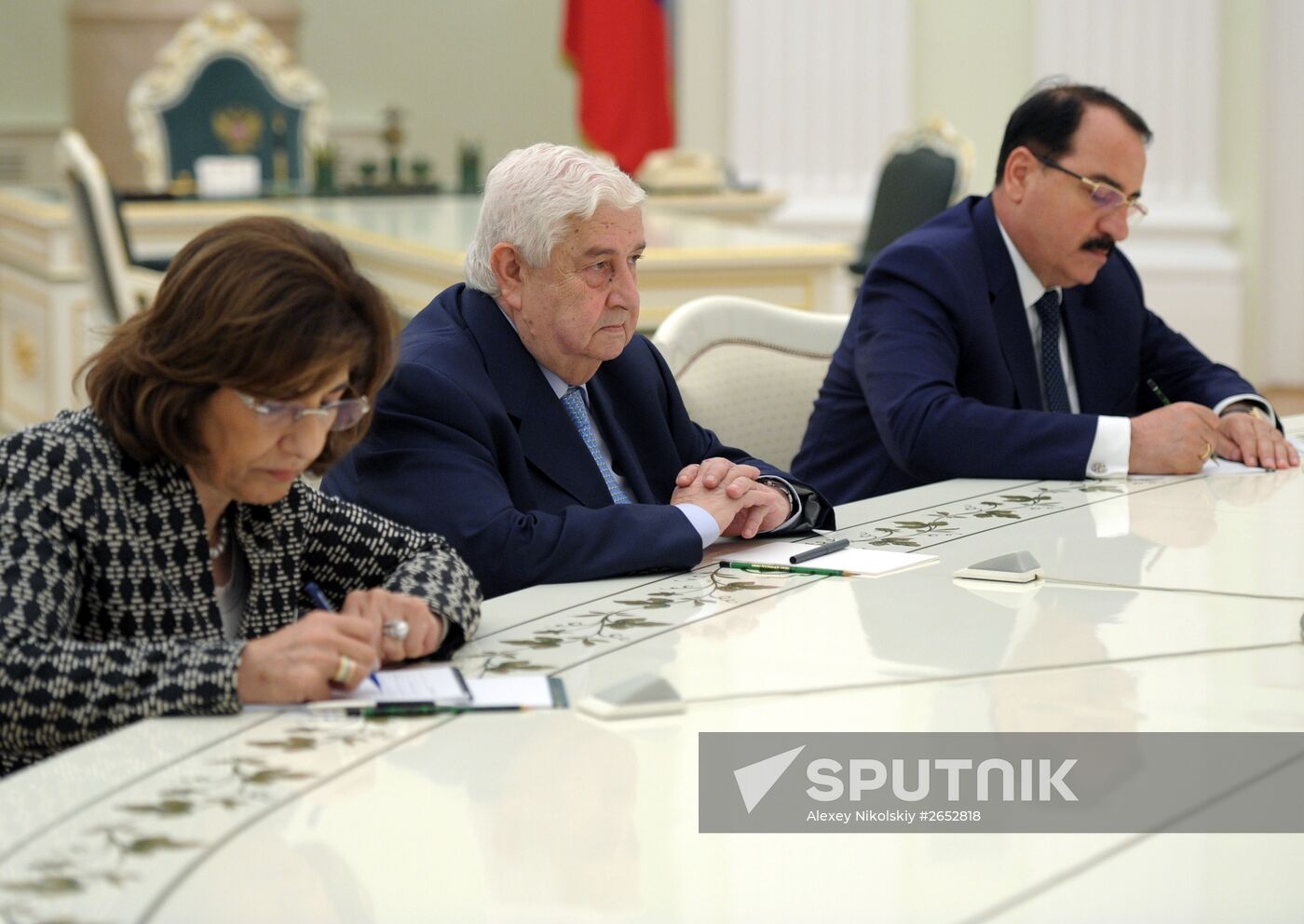 Russian President Vladimir Putin meets with Syrian Foreign Minister Walid Muallem