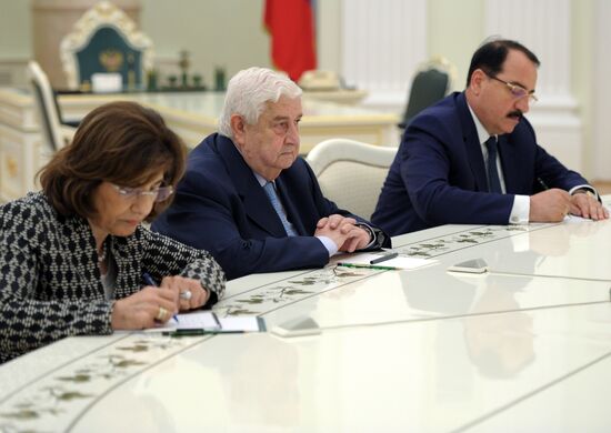 Russian President Vladimir Putin meets with Syrian Foreign Minister Walid Muallem