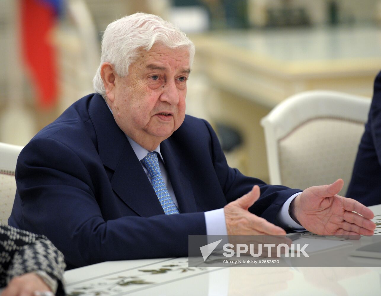 Russian President Vladimir Putin meets with Syrian Foreign Minister Walid Muallem
