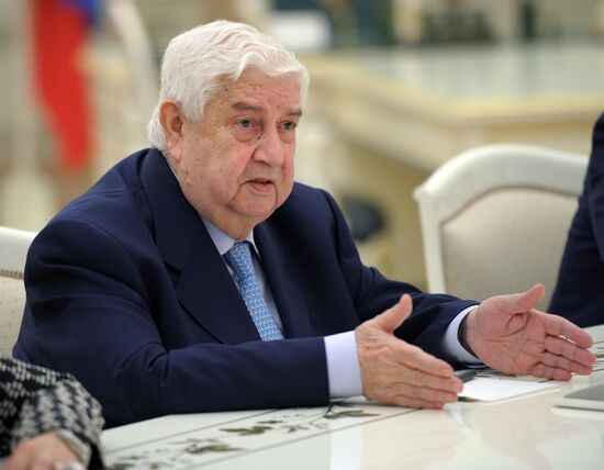 Russian President Vladimir Putin meets with Syrian Foreign Minister Walid Muallem