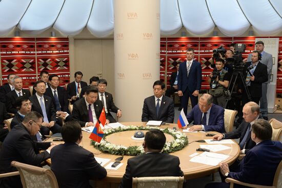 President of Russia Vladimir Putin meets with President of China Xi Jinping and President of Mongolia Tsakhiagiin Elbegdorj