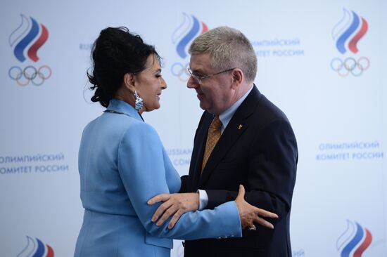 IOC President Thomas Bach presents Olympic Order to RRGF President Irina Viner-Usmanova