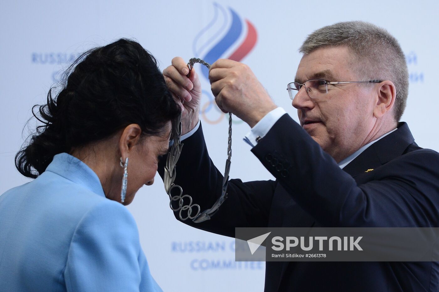 IOC President Thomas Bach presents Olympic Order to RRGF President Irina Viner-Usmanova