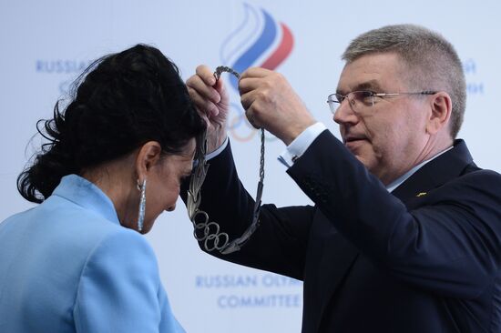 IOC President Thomas Bach presents Olympic Order to RRGF President Irina Viner-Usmanova