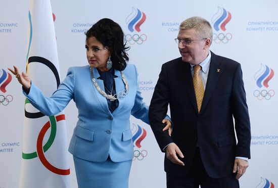 IOC President Thomas Bach presents Olympic Order to RRGF President Irina Viner-Usmanova