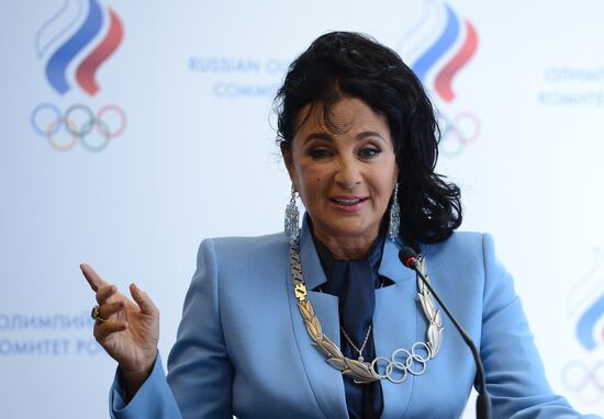 IOC President Thomas Bach presents Olympic Order to RRGF President Irina Viner-Usmanova