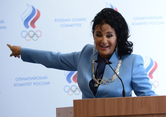 IOC President Thomas Bach presents Olympic Order to RRGF President Irina Viner-Usmanova