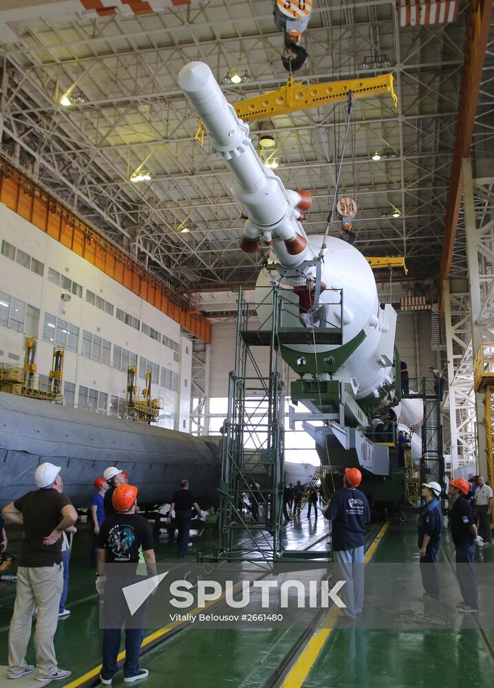 Soyuz TMA-17M spacecraft prepared for rollout to launch pad
