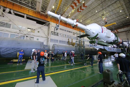 Soyuz TMA-17M spacecraft prepared for rollout to launch pad