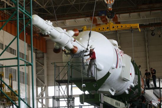 Soyuz TMA-17M spacecraft prepared for rollout to launch pad