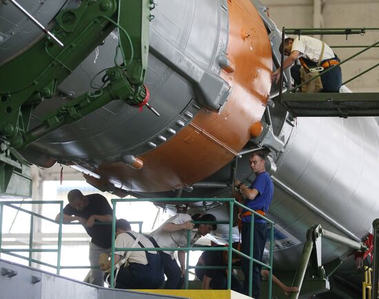 Soyuz TMA-17M spacecraft prepared for rollout to launch pad