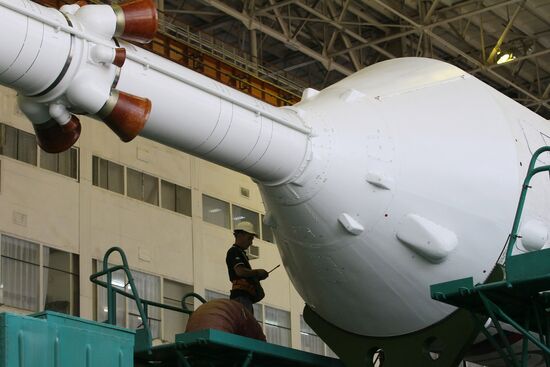 Soyuz TMA-17M spacecraft prepared for rollout to launch pad