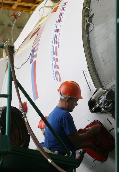 Soyuz TMA-17M spacecraft prepared for rollout to launch pad