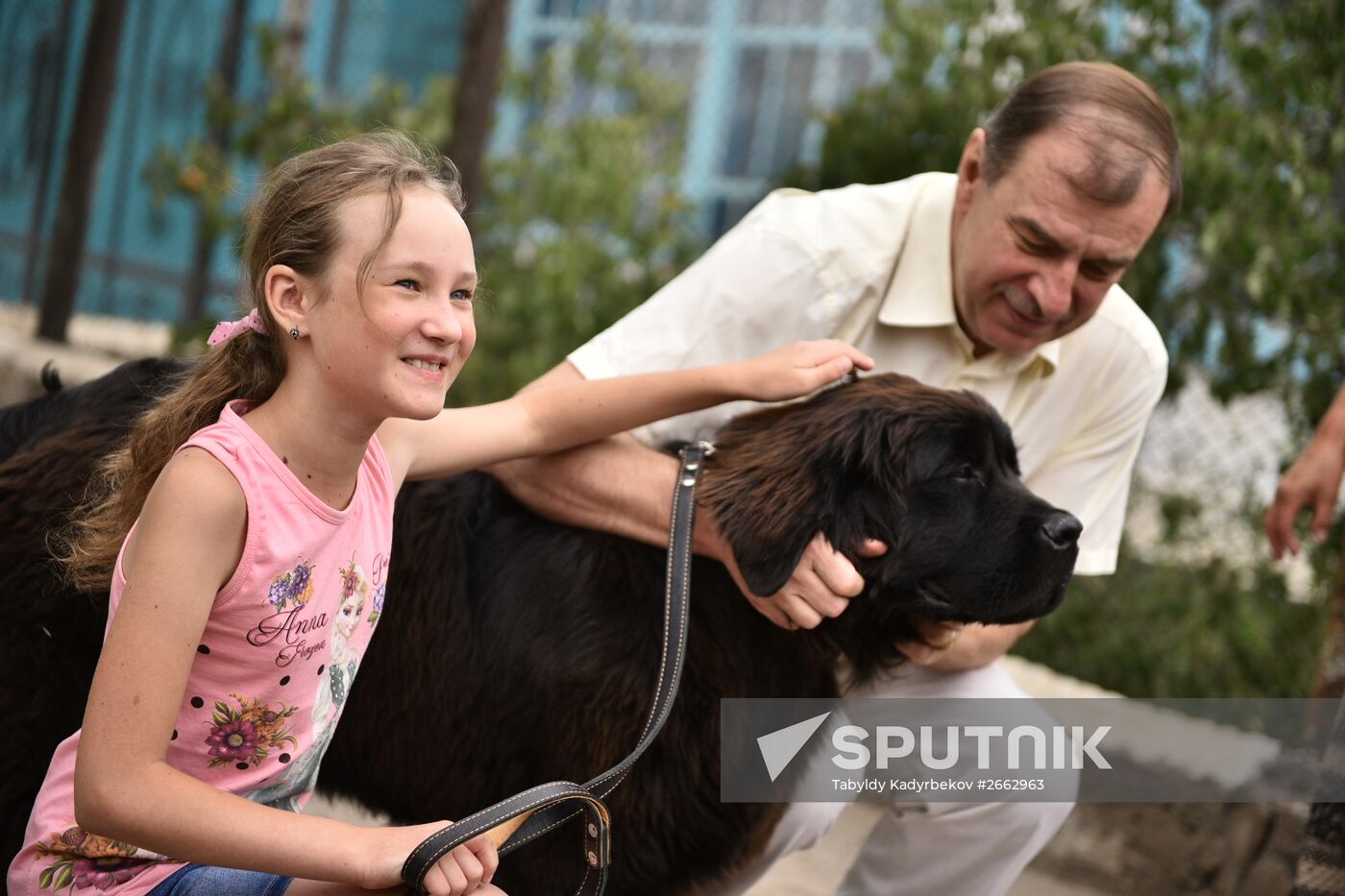 Dasha Yaitskaya with Newfoundland puppy, a gift from Russian President Vladimir Putin