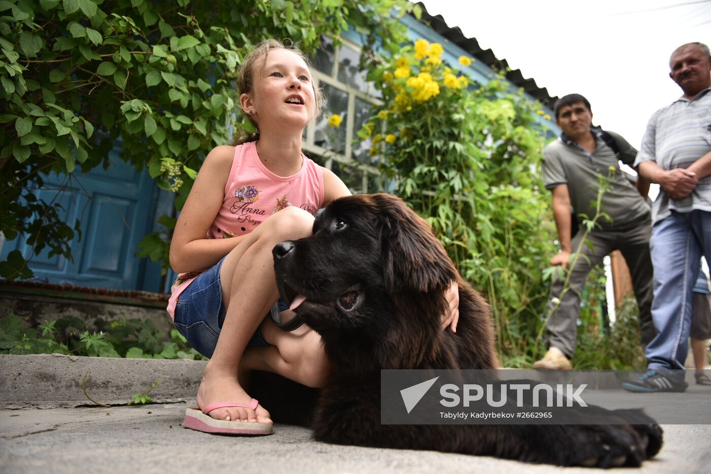 Dasha Yaitskaya with Newfoundland puppy, a gift from Russian President Vladimir Putin