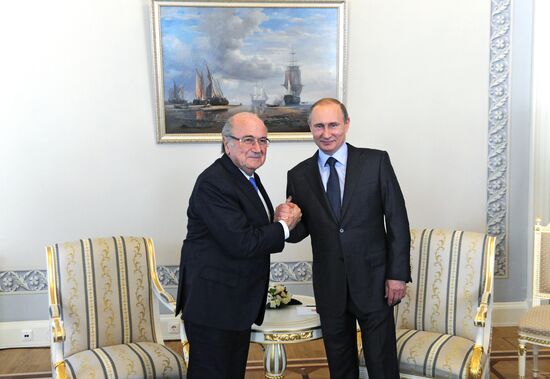 President Vladimir Putin meets with FIFA Presidentt Sepp Blatter